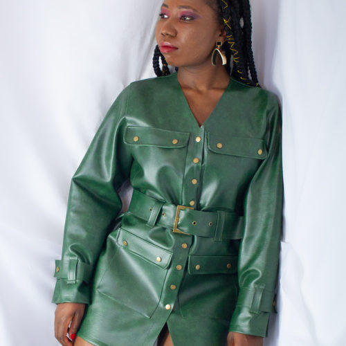 Tammy Silver wearing green leather jacket dress with belt