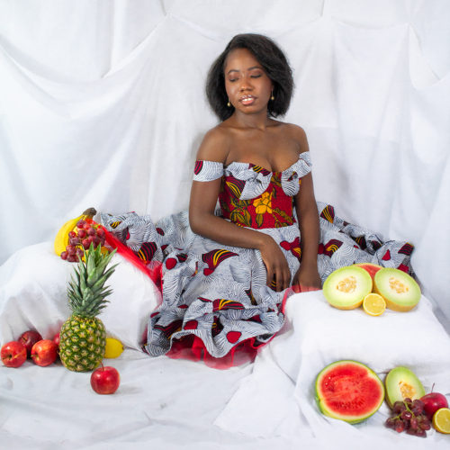 Tammy Silver wearing a red and white Ankara dress with red petticoat